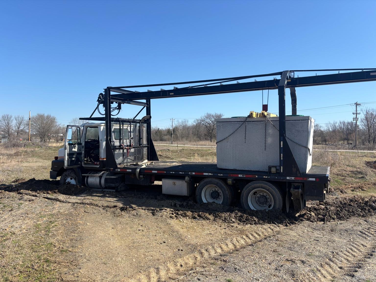 Truck transporting a septic tank